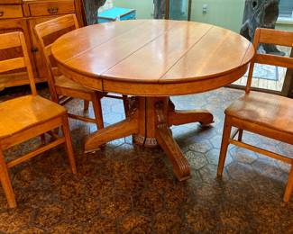 Vintage round oak pedestal table with three chairs 