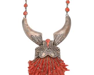 1192 A Sterling Silver Spiney Oyster Pendant Necklace The chunky necklace with two sterling silver concave links suspending a large spiny oyster pendant with elaborate sterling silver setting, with set polished graduated spiny oyster accent links to chain Stamped to plaque: 950  18 1/2 x 5 x 3 7/8 in. 161.5 grams gross Estimate: $200 - $400