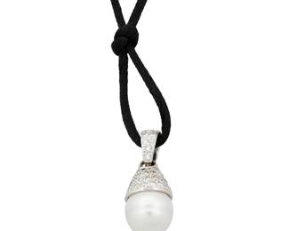 1035 A 14K White Gold, Cultured Pearl and Diamond Pendant Necklace Featuring a black silk cord suspending a pendant centering a single cultured pearl accented by round diamonds weighing approximately 1.20 carats  Length: 23 in. 9.8 grams gross Estimate: $300 - $500