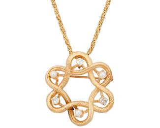 1005 A 14K Gold and Diamond Pendant Necklace Suspending a woven wreath style design accented by single-cut diamonds and seed pearls  Chain: 16 in., Pendant: 1 x 1 in. 10.6 grams gross Estimate: $700 - $900