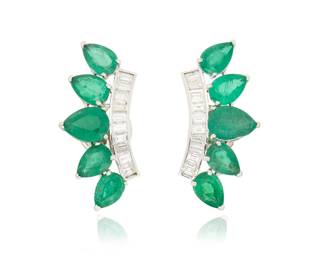 1042 A Pair of 18K White Gold, Emerald and Diamond Earrings Of a burst design with a row of baguette diamonds weighing approximately 0.60 carat, accented by graduated pear-shaped emeralds weighing approximately 2.05 carats 2 pieces  Measures: 7/8 in. 5.2 grams gross Estimate: $1,200 - $1,500