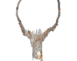 1028 Erte: A 14K Gold and Sterling Silver Necklace Of an organic textured design, featuring a carved mother-of-pearl female face, accented by single-cut diamonds, signed CFA, edition 111/250  Length: 16 in. 89.7 grams gross Estimate: $1,800 - $2,200