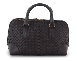1228 Bottega Veneta: Nappa Intrecciato 2-Way Top Handle Black Leather Handbag Circa 2007, Italy A two-handled doctor's-style bag with black woven leather exterior, two-way top zipper, and brass-toned hardware, with beige suede leather lining and two interior pockets Marked to interior leather pocket: Bottega Veneta / Made in Italy; 'Originality Certified' tag: 192938 / VFED0 / 1000 / EPEV / 2007 / 5622 A  6 1/2 x 10 1/2 x 5 in., drop: 3 in. Estimate: $400 - $600
