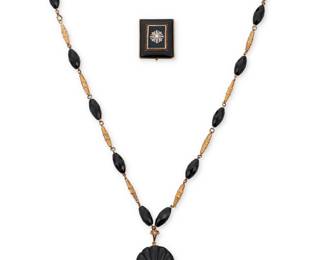 1052 A Gold and Onyx Mourning Brooch and Necklace Including a 9k gold and onyx bead necklace suspending a carved onyx pendant with compartment back, together with an 11k gold, onyx, diamond and seed pearl brooch engraved "Anna Pierce, Obt March 29, 1842, AE 78" 2 pieces  Chain: 28 in., Pendant: 2 in., Brooch: 1 1/4 x 1 1/2 in. 67.8 grams gross Estimate: $800 - $1,200