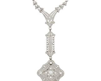 1072 A Platinum and Diamond Necklace Of an ornate filigree design featuring rose-cut and old mine-cut diamonds weighing approximately 1.80 carats  Length: 16 in., Drop: 4 in. 16.9 grams gross Estimate: $2,800 - $3,500