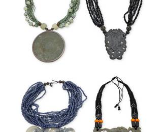 1212 Four Southeast Asian-style Carved Hardstone Necklaces Comprising a carved greystone pendant suspended from multistrands of black and grey glass beads (marked 'j'), a carved varigated stone pendant suspended from multistrands of grey/blue glass beads (with hangtag: JANNA/925), a carved greenstone roundel suspended from multistrands of various greenstone beads, and a carved stone half-circle pendant suspended from black knotted macramé cording with bead accents, 4 pieces  Largest: 18 1/2 x 4 in.; Smallest: 14 x 3 in. (adjustable) 830 .2 grams gross Estimate: $300 - $500