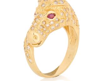 1164 An 18K Gold, Ruby and Diamond Ring Of a horse head design set with round diamonds and two round rubies  Size: 7 9.10 grams gross Estimate: $1,500 - $2,000