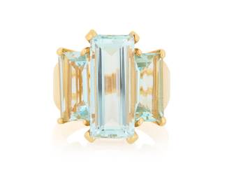 1183 An 18K Gold and Aquamarine Ring Featuring three rectangular step-cut aquamarines  Size: 7 11.2 grams gross Estimate: $1,800 - $2,200