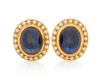 1169 A Pair of 18K Gold, Sapphire and Diamond Earrings Centering two sapphire double cabochons weighing approximately 7.85 carats each, encircled by round diamonds weighing approximately 1.00 carats total 2 pieces  Measures: 7/8 x 5/8 in. 17.9 grams gross Estimate: $2,500 - $3,500