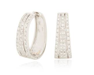 1038 A Pair of 18K White Gold and Diamond Hoop Earrings Featuring four rows of round diamonds weighing approximately 1.40 carats total, with Italian workshop marks 2 pieces  Measures: 3/8 x 1 in. 10.5 grams gross Estimate: $1,200 - $1,500