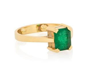 1020 An 18K Gold and Emerald Ring Featuring a single cut-cornered rectangular step-cut emerald weighing approximately 1.25 carats  Size: 6 with sizing beads 4.1 grams gross Estimate: $600 - $800