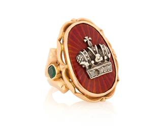 1161 A 14K Gold, Enamel and Emerald Ring Featuring red guilloche enamel centering a crown motif set with rose-cut diamonds, accented by two oval emeralds  22.2 grams gross Size: 9 Estimate: $1,500 - $2,000