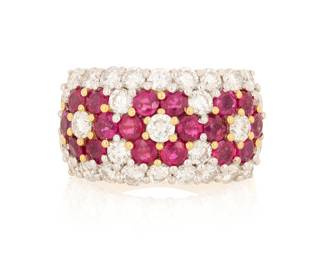 1080 An 18K Bi-Color, Ruby and Diamond Ring Featuring round rubies set in a floral design accented by round diamonds weighing approximately 2.50 carats, marked CB  Size: 7 13.4 grams gross Estimate: $2,500 - $3,500