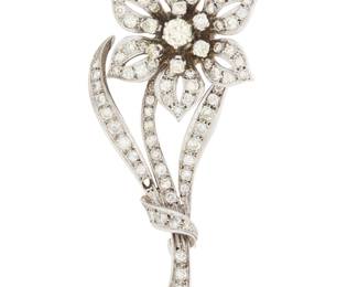 1201 A Sterling Silver and Diamond Flower Brooch Of a floral design set with round diamonds weighing approximately 2.96 carats  Measures: 2 1/4 x 1 in. 11.0 grams gross Estimate: $1,800 - $2,500