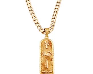 1022 A 14K Gold Chain and 18K Gold Pendant Of a curb-link chain suspending an Egyptian motif pendant 2 pieces  Chain: 24 in., Pendant: 2 x 1/2 in. 27.8 grams gross Estimate: $1,800 - $2,500
