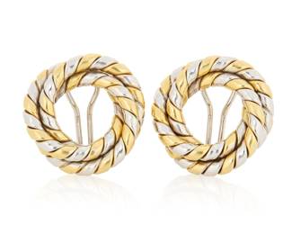 1079 A Pair of 18K Bi-Color Gold Earrings Of a twisted spiraling design featuring white and yellow gold, with maker's mark and Italian workshop marks 2 pieces  Measures: 1 x 1 in. 18.5 grams gross Estimate: $2,500 - $3,500