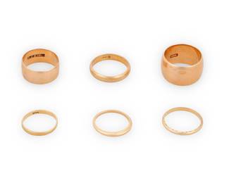 1107 A Group of Gold Rings Including two 18k gold and four 14k gold bands 6 pieces  Sizes: 5 1/4 - 8 3/4 27.7 grams Estimate: $1,800 - $2,200