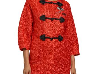 1252 Ermanno Scervino: A Red Embroidered Lace Evening Coat Circa 2010s-2020s An overcoat-style long jacket in bright red polyester/nylon embroidered lace fabric, with round neck and dropped shoulders, 3/4 lantern sleeves, three black cord passementerie toggle fasteners as well as four large red resin branded snaps, and three applied diamanté vintage brooch-style motifs to upper left, with two inseam pockets Label: Ermanno Scervino / Italy  Size 40 IT / US 4 Measurements: CB length: 33 1/2 in.; bust across front: 21 in.; waist across front: 21 in.; across shoulders at back: 18 1/2 in.; sleeves: 16 1/2 in. Estimate: $300 - $500