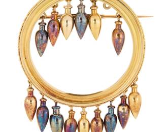 1045 A Victorian 18K Gold Brooch Of a circle design suspending fifteen dangling vessel motif elements  Measures: 1 3/4 x 2 1/4 in. 17.8 grams gross Estimate: $2,000 - $3,000