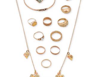 1096 A Group of Gold Jewelry Including ten rings, one bangle, one brooch and one necklace 13 pieces  Rings: 5 1/4 -10, Bangle: 8 1/4 in., Brooch: 7/8 x 5/8 in., Necklace: 26 in. 64.7 grams gross Estimate: $2,200 - $2,800