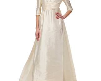 1220 A Vintage Silk Satin Beaded Wedding Dress Attributed to Christian Dior Circa 1964 A scoop-neck hand-finished empire waist dress in textured ivory silk fabric in a pique-style weave, with floral beadwork and metal thread embroidery to the neckline front and back, elbow length sleeves, and with a gathered and pleated skirt with ruched waistband sash, center back zip, and integral train with additional floral beadwork and metal thread embroidery to hem  Bust: 34 in.; Waist 24 in.; Across shoulders at back: 14 in.; Hips: (pleated, generous); Sleeve: 15 1/4 in.; Shoulder to hem at front: 57 in.; Center Back: 52 in.; Train: 78 in. x 39 in. Estimate: $2,000 - $3,000