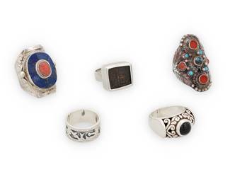 1206 Five Silver and Set Stone Rings Comprising two chased sterling silver rings with multiple set stones, including coral and various blue stones, as well as two sterling bands, one with wirework and set onyx, and one with pictorial silver overlay, and a small silver metal ring with a square set stamped or carved relief fragment, possibly ceramic 5 pieces  Ring sizes 7 to 4 3/4 55.9 grams gross Estimate: $200 - $400
