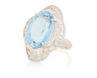 1030 A Platinum, Blue Topaz and Diamond Ring Centering an oval blue topaz weighing approximately 18.22 carats, accented by tapered baguette diamonds weighing 2.08 carats  Size: 6 1/2 16.7 grams gross Estimate: $2,200 - $2,800