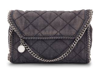 1244 Stella McCartney: A Quilted Denim Small Falabella Shoulder Bag Circa 2015, Italy The front flap bag in quilted distressed washed denim, with branded gunmetal silver-tone hardware, bag charm, chain strap, and with whipstitch and chain edging details, the interior with branded black fabric lining and one slip in pocket Marked to interior pocket: Stella McCartney / Made in Italy; Interior tag: 364519 / W9597 / 495151 / S15  6 x 9 x 2 3/4 in., drop: 20 in. Estimate: $200 - $400