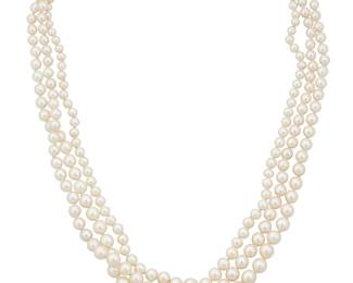 1036 A Platinum, Cultured Pearl and Emerald Necklace Featuring three graduated rows of cultured pearls measuring approximately 3.7 - 8.7 mm, finished with a platinum clasp centering a rectangular-cut emerald and single-cut diamonds  Length: 20 in. 70.7 grams gross Estimate: $1,800 - $2,200