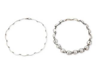 1196 Two Sterling Silver Link Necklaces Comprising a Dragstead Danish silver floriform link necklace, together with a Taxco Mexican silver link necklace, each marked for maker, country, and sterling  Lengths 17 1/2 in. & 19 in. 56.8 grams gross Estimate: $300 - $500