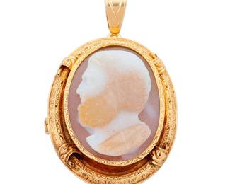 1018 A 18K Gold and Sardonyx Cameo Brooch/Pendant Centering a male portrait in sardonyx, set in an ornately engraved frame, with French import mark  Measures: 2 x 1 1/2 in. 19.2 grams gross Estimate: $1,200 - $1,800