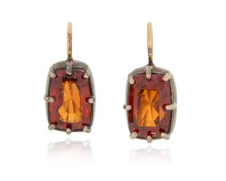 1139 A Pair of Silver Topped-Gold and Hessonite Garnet Earrings Centering two rectangular mixed-cut hessonite garnets 2 pieces  Measures: 3/4 x 3/8 in. 4.8 grams gross Estimate: $1,000 - $1,500
