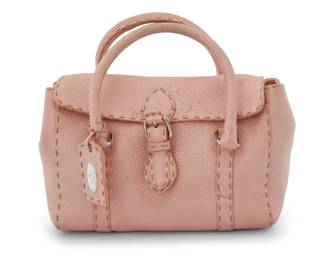 1231 Fendi: A Pink Mini Borso Selleria Linda Handle Bag Circa 2000s, Italy A small satchel-style tote bag in pearly pale pink textured leather with small luggage tag, rolled leather handles with silver-toned branded hardware, and with beige suede lining with one leather-trimmed interior zip pocket With interior sterling silver plaque: Fendi / Selleria / Lavorazione a mano / Serie numerata: No 49-23-12384 / 1925 / Roma / Italia / Sterling; further marked to interior leather tag: 2373-8BR486-NDU-058; with hologram tag: A213484; buckle stamped: Fendi / Made in Italy  6 x 9 x 4 1/2 in., drop: 4 in. Estimate: $200 - $400