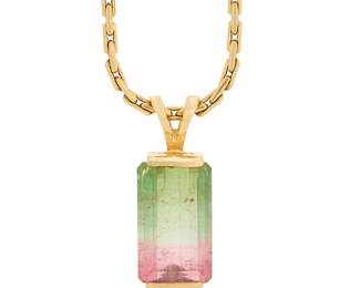 1008 A 14K Gold and Watermelon Tourmaline Necklace Featuring an emerald-cut watermelon tourmaline, suspended from a fancy link chain  Length: 18 in., Pendant: 3/4 in. 14.5 grams Estimate: $1,000 - $2,000
