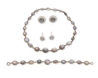 1140 A Group of Grey Star Sapphire and Moonstone Jewelry Including a silver necklace, bracelet and pair of earrings set with oval grey star sapphire double cabochons, together with a pair of 14k white gold, grey moonstone and colorless stone earrings 6 pieces  Necklace: 13 1/2 in., Bracelet: 6 1/2 in., Earrings: 1/2 in. 50.8 grams gross Estimate: $600 - $800