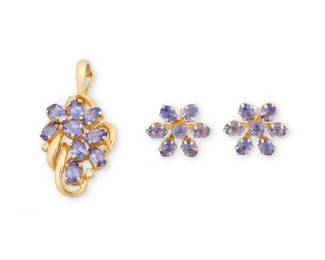 1156 A 14K Gold and Tanzanite Pendant and Earring Set Including a pendant and pair of earrings of a floral motif set with oval tanzanites 3 pieces  Pendant: 1 3/8 in., Earrings: 1/2 in. 5.0 grams gross Estimate: $400 - $600