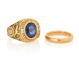 1102 Two 14K Gold Rings Including one featuring a cabochon synthetic sapphire in a decorative engraved mount, and one high polish gold band 2 pieces  Size: 7.5 and 10.5 30.0 grams gross Estimate: $1,500 - $2,000