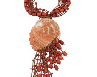 1124 A Large Coral and Abalone Pendant Necklace Comprising a multistrand coral and brown stone beaded necklace suspending a large abalone shell, the strands terminating in asymmetrical beaded dangles, with silver cone clasp Stamped to each cone: j [script]  17 x 9 1/2 x 3 3/4 in. 241.2 grams gross. Estimate: $200 - $400