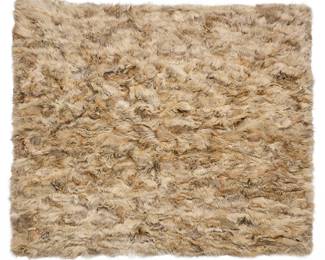 1259 Adrienne Landau: A Coyote Fur King Coverlet The large coverlet of cream, brown, grey, and black variegated fur with areas of varying lengths and textures, with a brown velour backing and labeled "Adrienne Landau"  75 x 88 1/2 in. approximately Estimate: $500 - $700