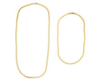 1091 Two 14K Gold Chains Both of a flat link design 2 pieces  Length: 15 in. and 23 in. 30.0 grams gross Estimate: $1,800 - $2,200