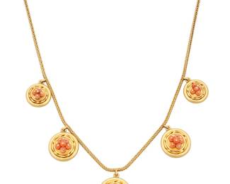 1046 A Victorian Gold and Coral Mourning Necklace Featuring five graduated round elements accented by coral beads and featuring back compartments with glass  Length: 15 in., pendants: 5/8 - 7/8 in. 24.7 grams gross Estimate: $2,800 - $3,500