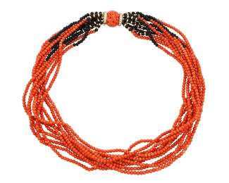 1123 An 18K Gold, Coral and Onyx Torsade Necklace Featuring ten strands of coral, onyx and gold beads finished with a carved coral clasp accented by round diamonds  Length: 19 1/2 in. 92.4 grams gross Estimate: $1,800 - $2,200