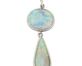 1031 A Platinum and Opal Pendant Featuring an oval and pear-shaped opal cabochons  Measures: 1 1/2 x 1 /2 in. 3.2 grams gross Estimate: $600 - $800