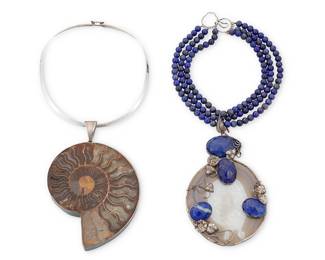 1216 Two Studio Art Stone Statement Pendant Necklaces Comprising a sterling silver modernist collar suspending a large ammonite-style fossil stone pendant, together with a triple strand choker of lapis lazuli beads suspending an elaborate sterling silver set agate slice pendant with lapis lazuli faceted cabochons, featuring entwined flowers, leaves and wire accents, the fossil marked Michael and for sterling, 2 pieces  Fossil: 16 x 6 in.; Lapis: 14 1/2 x 6 1/2 in. 535.6 grams gross Estimate: $200 - $400