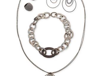 1189 Pesavento: A Group of 'Polvere Di Sogni' Sterling Silver Jewelry Featuring a chunky chain link collar necklace of blackened sterling silver oval links with a central powdered brown 'polvere' glitter link, and two similar style domed brown polvere cocktail rings, as well as a delicate darkened brown sterling silver sautoir necklace suspending a graduated oval hoop pendant and a pair of matching earrings, each signed and with Italian assay marks 6 pieces  Necklaces: 34 in. L & 19 1/2 in. L; Earrings: 3 in. H; Ring sizes: 8 151.3 grams gross Estimate: $500 - $700