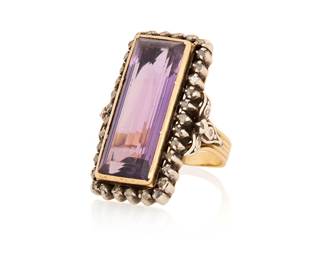 1138 A Silver Topped-Gold, Amethyst and Diamond Ring Featuring an elongated rectangular step-cut amethyst measuring approximately 26.00 x 9.80 x 6.78 mm encircled by rose-cut diamonds  Size: 8 13.3 grams gross Estimate: $800 - $1,200