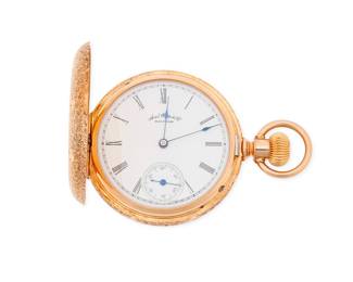 1054 American Waltham: 14K Gold Pocket Watch Dial: white with Roman numeral hour markers Case number: 27464 Signed: dial and movement  Size: 12s 61.2 grams gross Estimate: $800 - $1,200