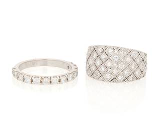 1076 Two Diamond Rings Including a platinum and diamond lattice motif ring, together with an 18k white gold and diamond half eternity band ring 2 pieces  Sizes: 5 1/2 and 7 3/4 1.1 grams gross Estimate: $800 - $1,200