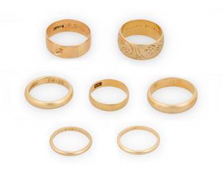 1105 A Group of Gold Rings Including six 14k gold bands together with one 18k gold band 7 pieces  Sizes: 5 3/4 - 11 1/4 30.5 grams Estimate: $1,800 - $2,200