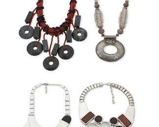 1195 A Group of Modernist-style Necklaces Comprising a beaded necklace suspending a sterling silver hammered oval disc with filigree overlay spacers (20 1/2 x 2 7/8 in.), a knotted cord necklace suspending various carved black stone disc and rectangular beads (18 x 4 in.), and two chunky collar necklaces in silver-toned metal, one with multiple flat dots of various sizes set with leather and glass shapes (19 1/2 x 3 1/2 in.), and one with curved metal tabs set with black colored wood elements (18 x 3 in.), 4 pieces  751.5 grams gross Estimate: $300 - $500